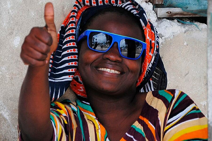 a woman wearing blue sunglasses