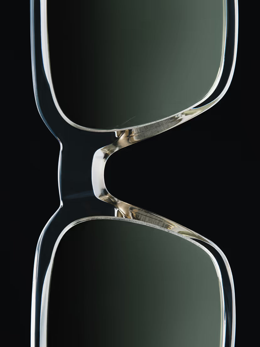 These sunglasses appear to be the Paul Smith Austin model, featuring a distinctive square frame with a transparent, laminated acetate finish.